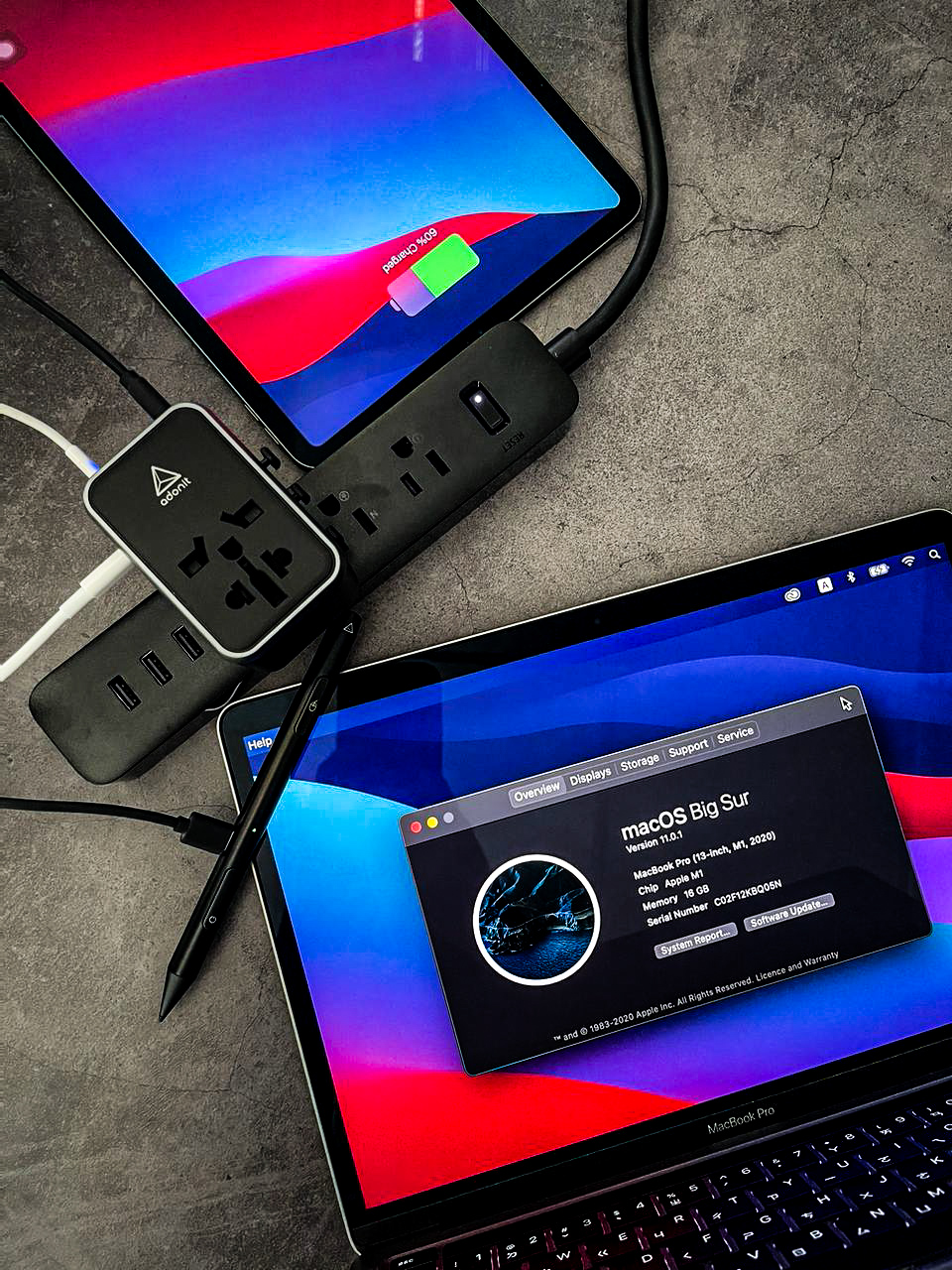 Adonit adapter charging devices on a concrete surface