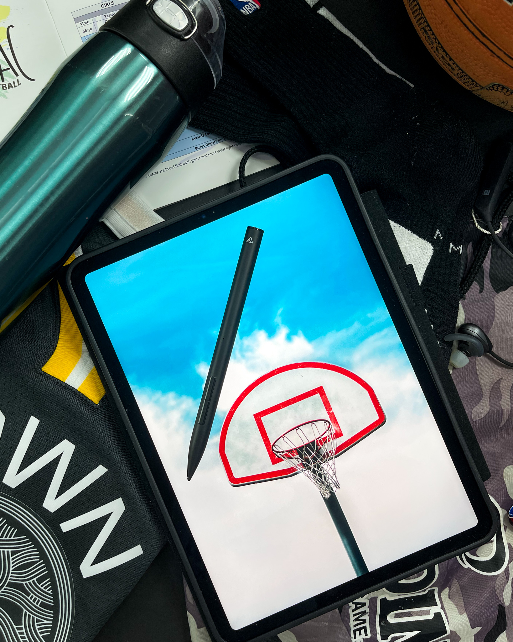 Basketball hoop on iPad with NBA socks and a Spalding ball