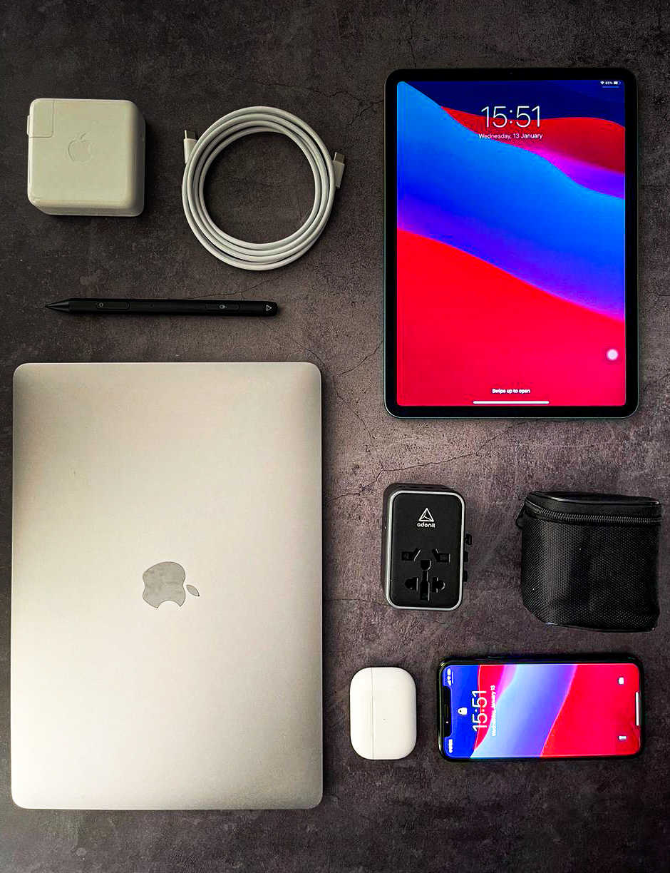 Flat-lay of MacBook, iPad, iPhone and the Adonit universal adapter
