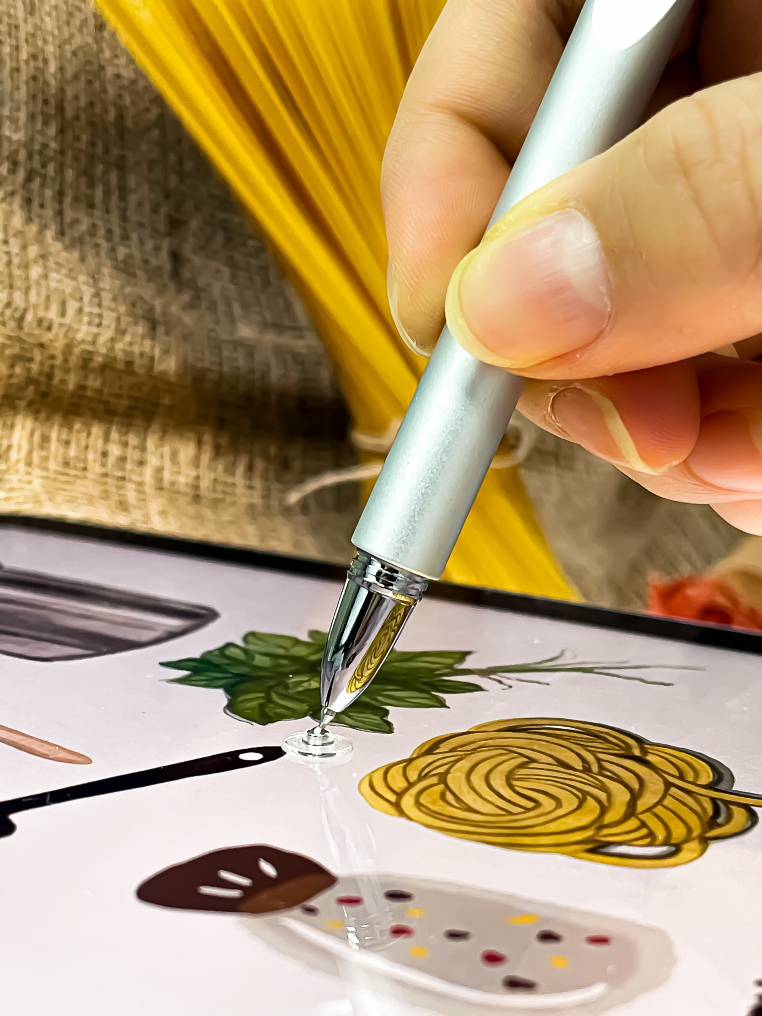 Illustrating a recipe on iPad, pasta in the background