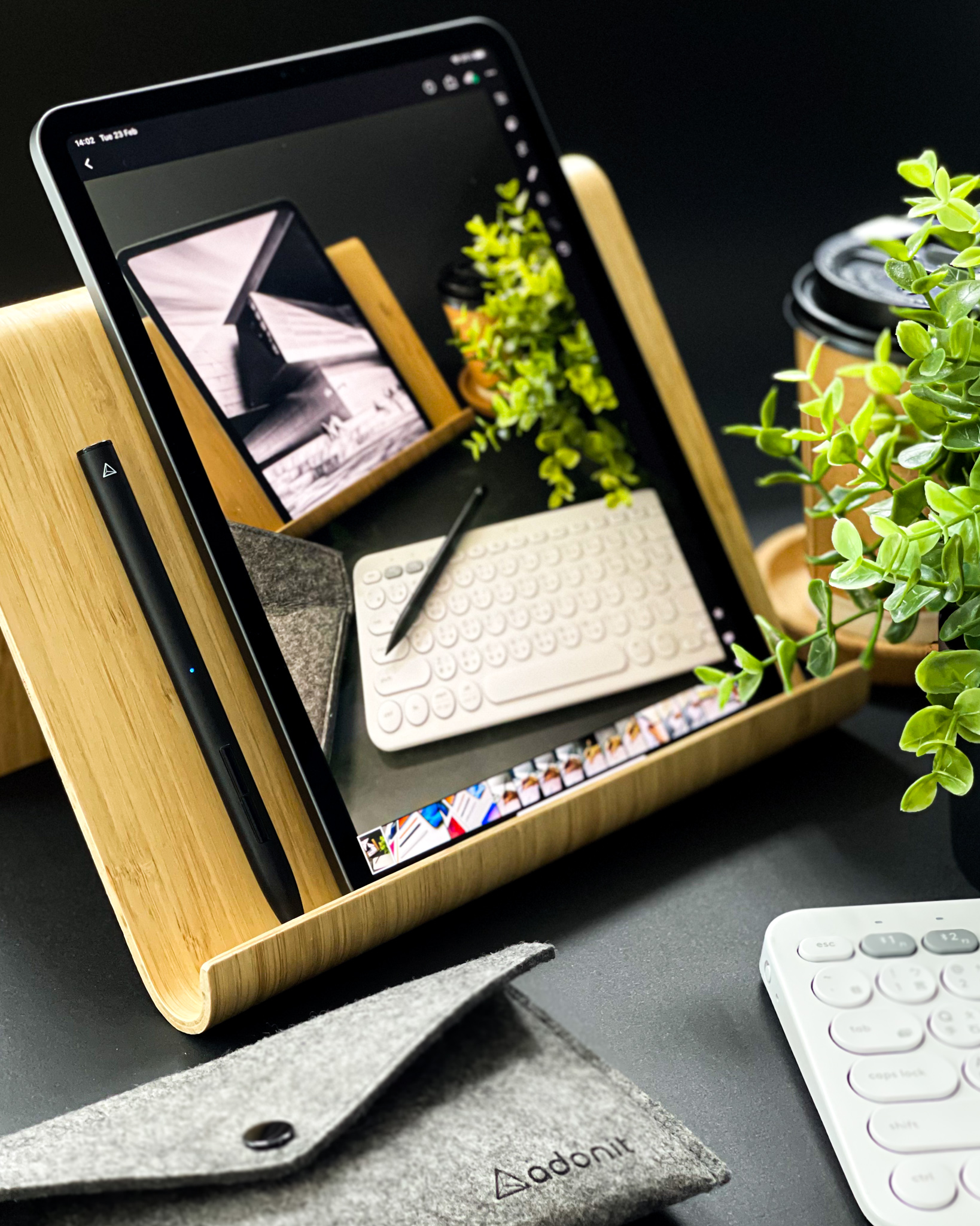 Stylus and iPad on a wooden stand, editing a black-and-white photo