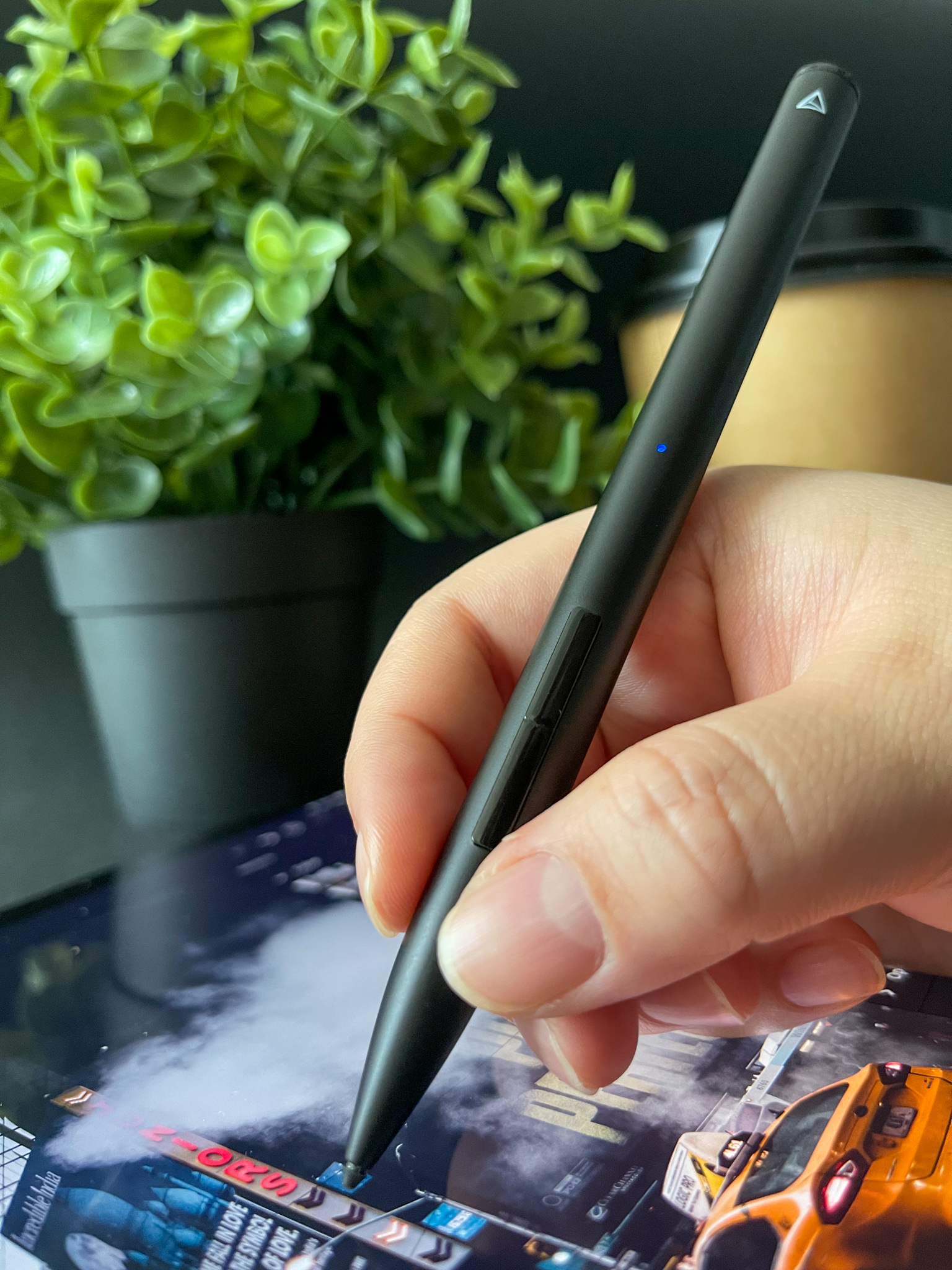 Stylus poised over a photo edit on iPad